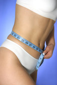 photo of tape measure around a woman's waist